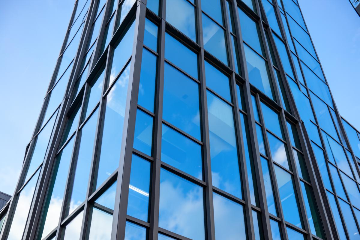 Tinted glass curtain wall on a modern commercial office building